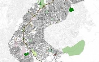 Mapa urbano com malha viária e áreas verdes destacadas