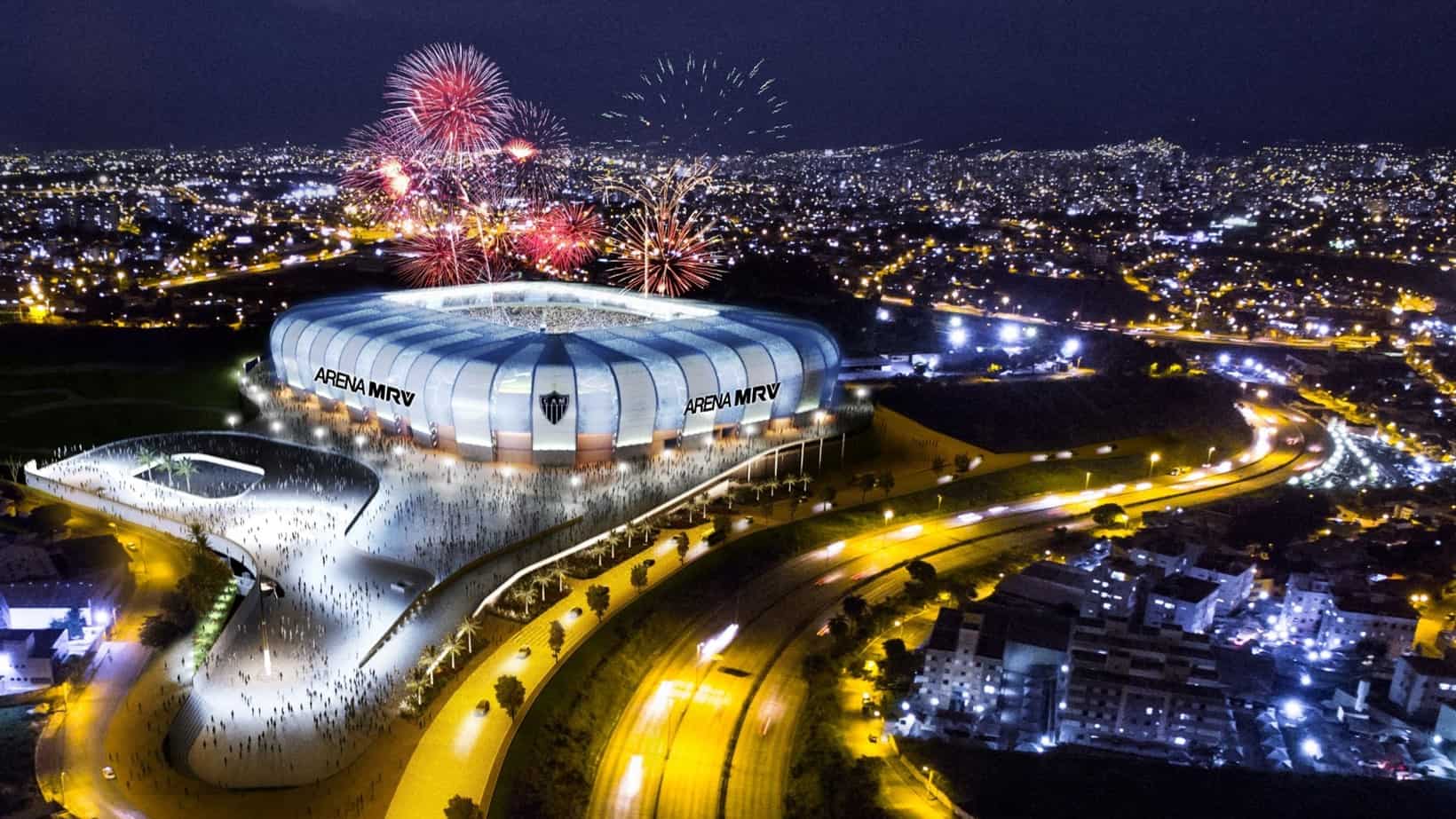Vista aérea noturna da Arena MRV iluminada com fogos e público no entorno